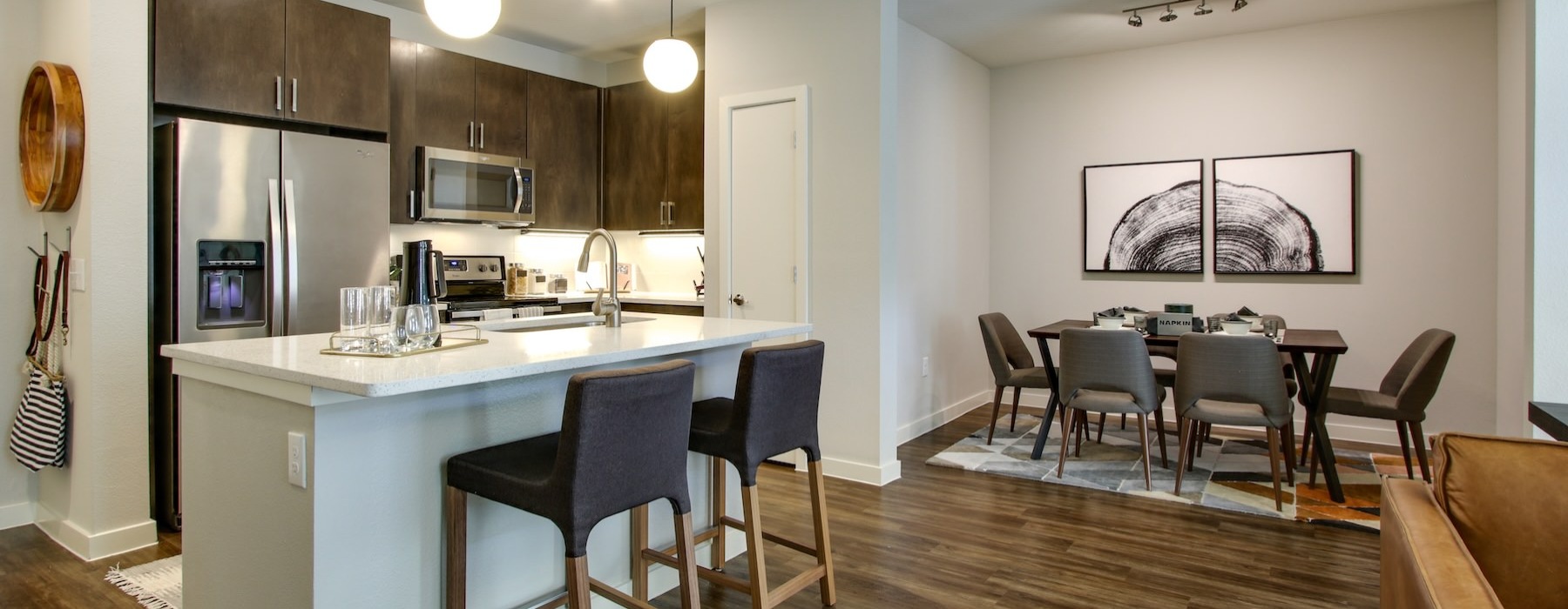 a kitchen with tables and chairs